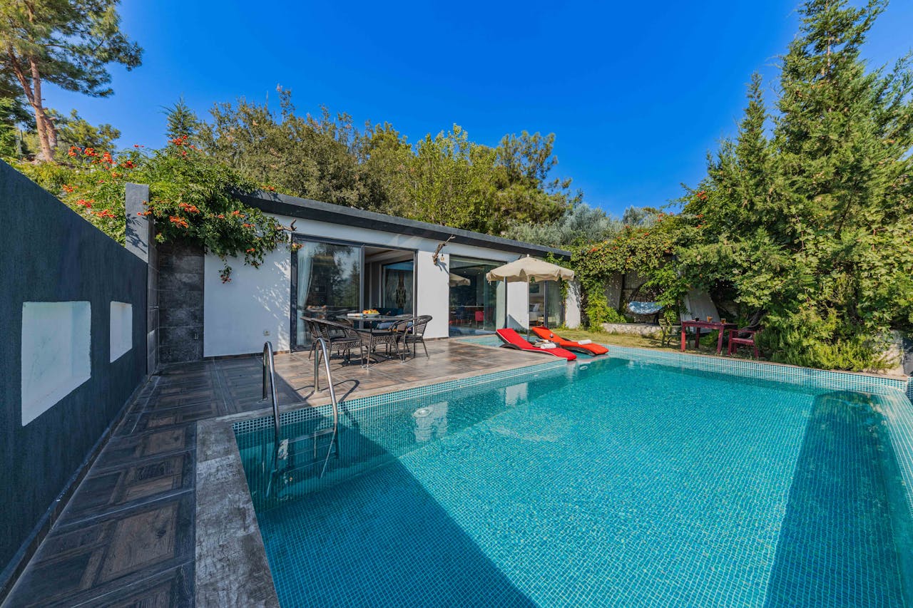 Experience serenity at a stylish villa with a private outdoor swimming pool.